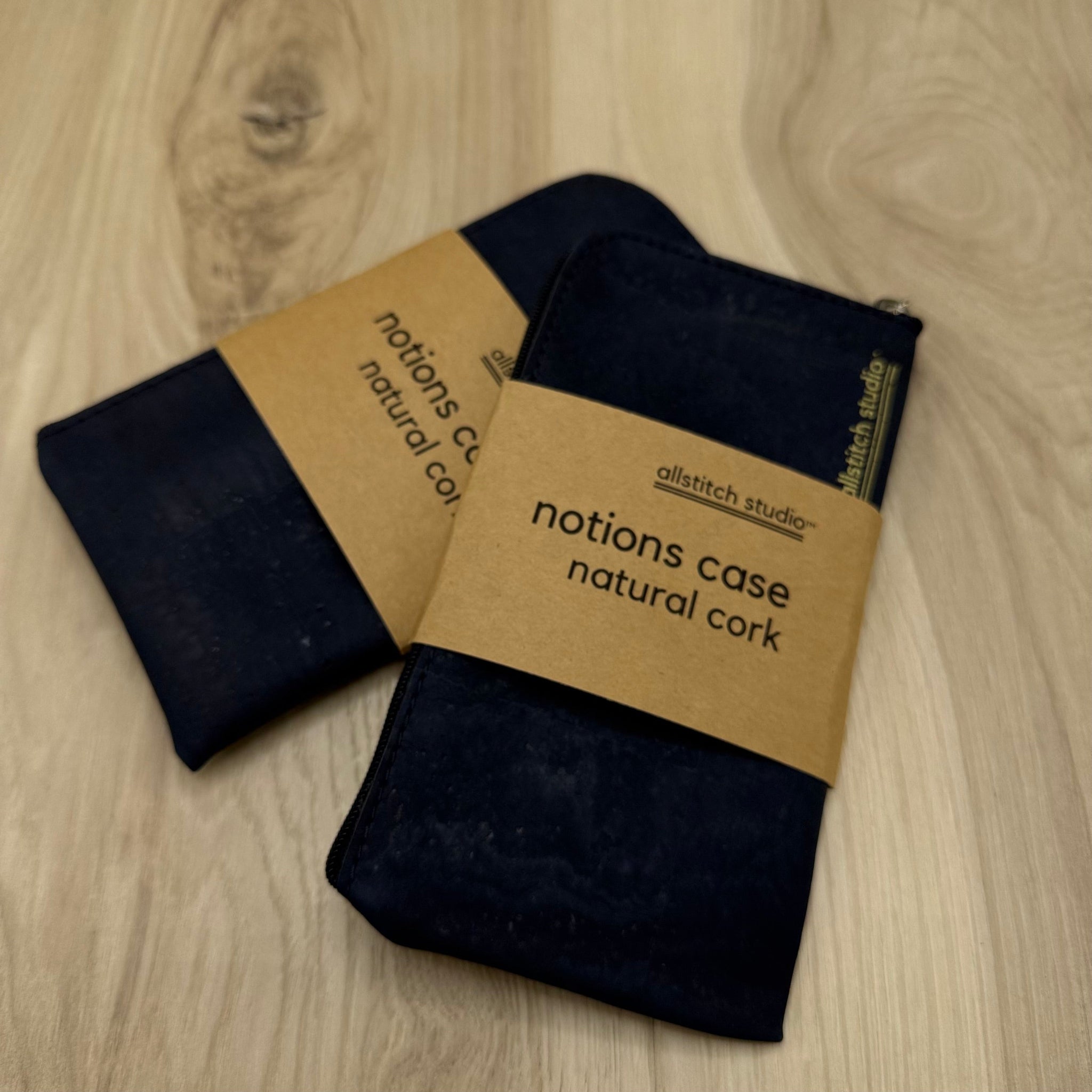 Black fabric case with a brown label on a wooden surface