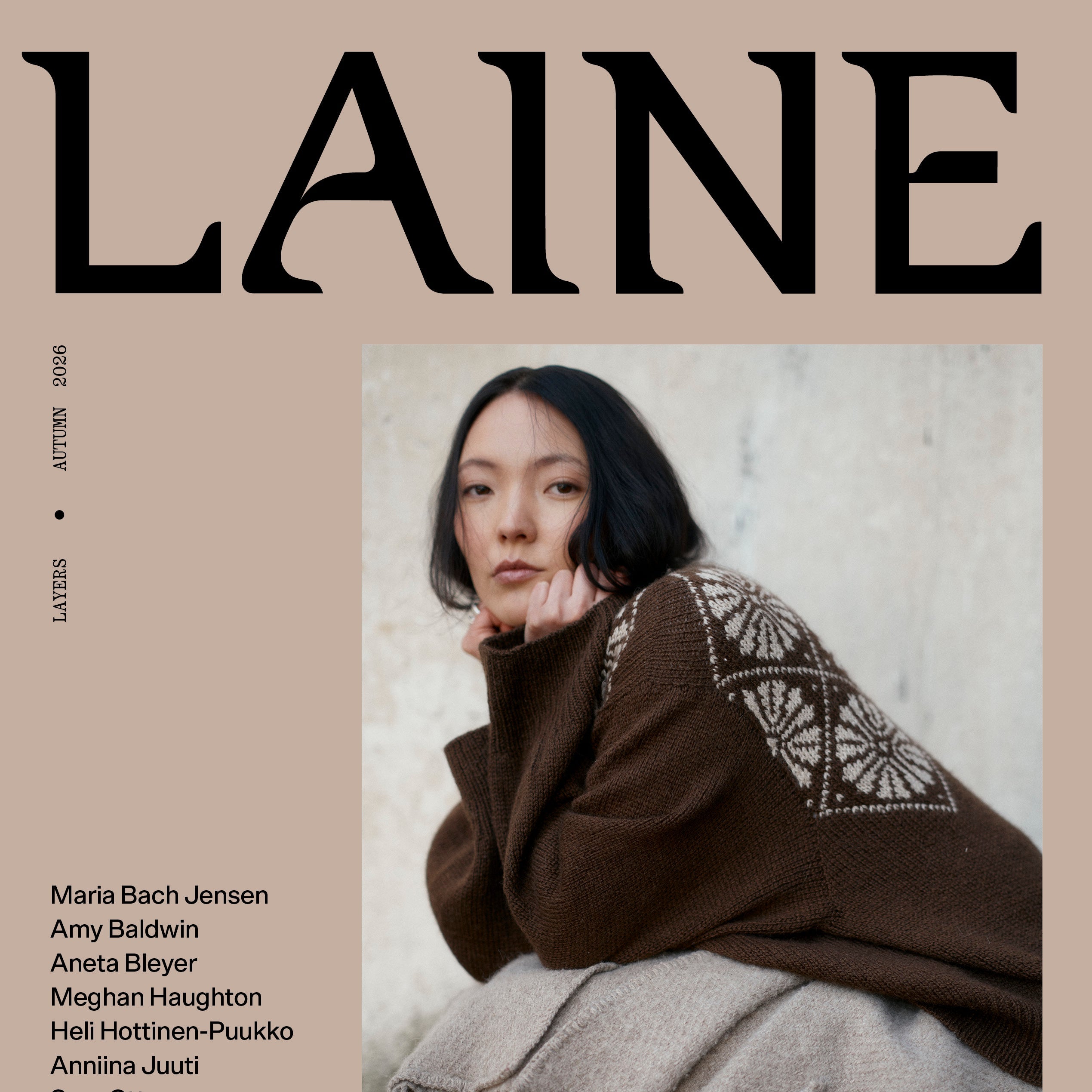 LAINE magazine cover, Autumn 2025 issue, featuring a model wearing a brown knit sweater with white geometric embroidery and a beige fringed scarf, set against a beige background with the brand name LAINE in large black letters.